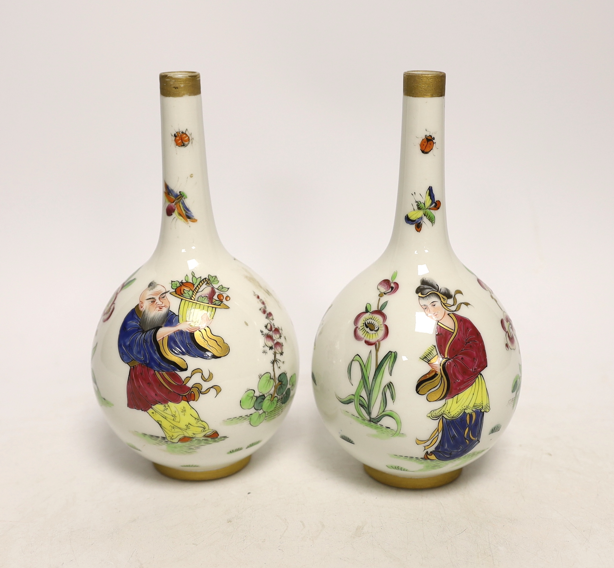 A pair of Continental porcelain bottle neck vases, 17cm high